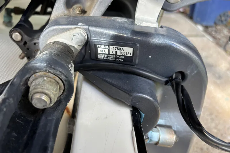 Slide: The Image of Close-up of Yamaha F175XA engine part on a 1999 Contender 21 Open boat. - 8