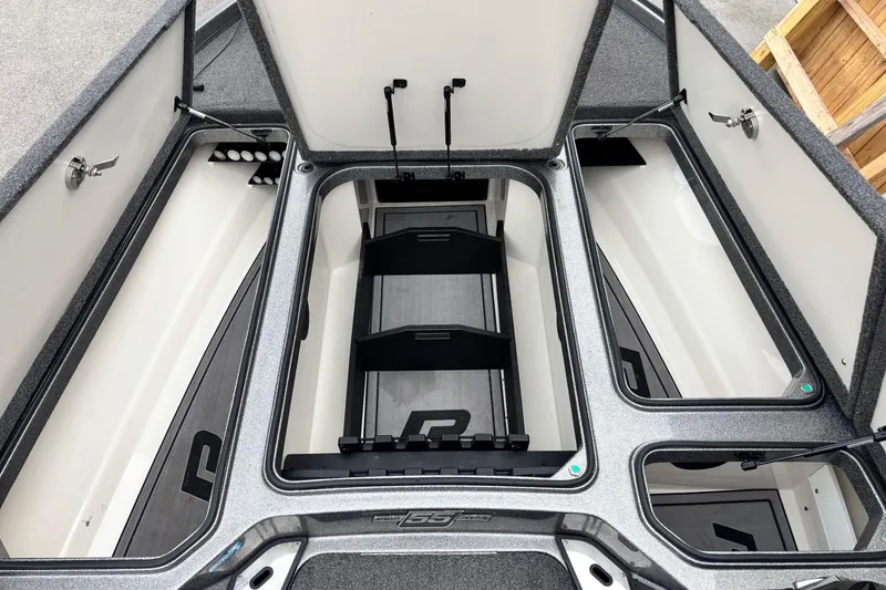Slide: The Image of 2023 Ranger Z520R boat storage compartments with open lids, showcasing organized interior space. - 6