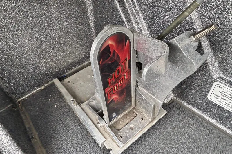 Slide: The Image of Hot Foot throttle pedal in 2023 Ranger Z520R boat, featuring a textured metal design. - 8