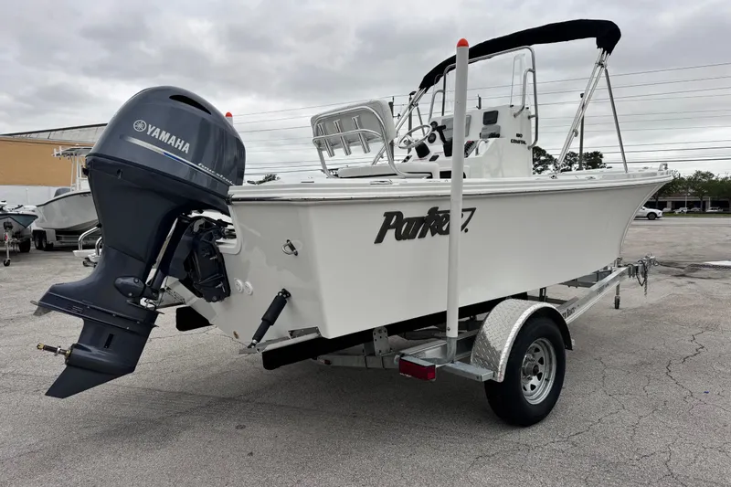 Slide: The Image of 2026 Parker 180 Coastal boat with Yamaha outboard motor on a trailer. - 10