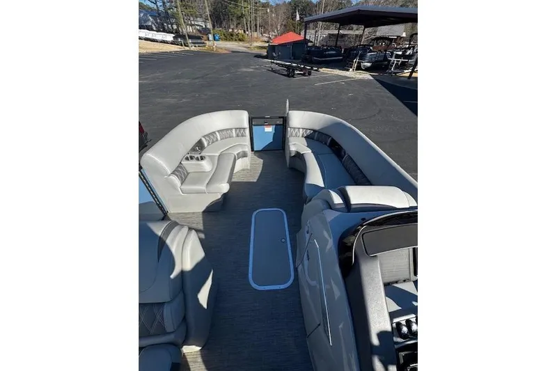 Slide: The Image of 2021 Bennington 23 LXS Swingback pontoon boat interior with gray seating and spacious layout. - 4
