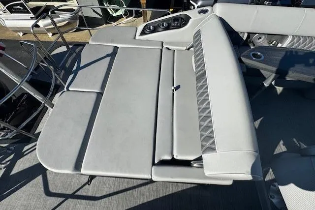 Slide: The Image of 2021 Bennington 23 LXS Swingback boat interior with adjustable seating and cup holders. - 6