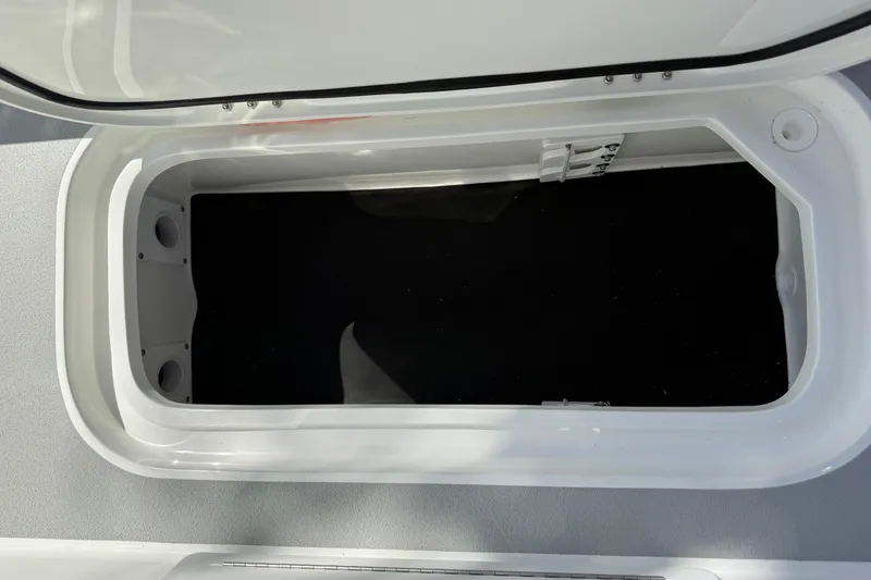 Slide: The Image of Open storage compartment on a 2026 Shallow Sport 25 X3 boat. - 19
