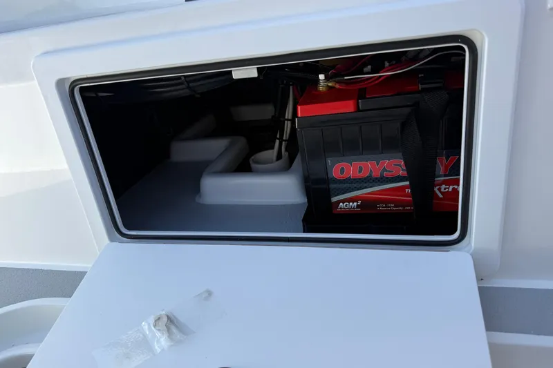 Slide: The Image of Battery compartment of 2026 Shallow Sport 25 X3 boat with Odyssey AGM battery. - 21