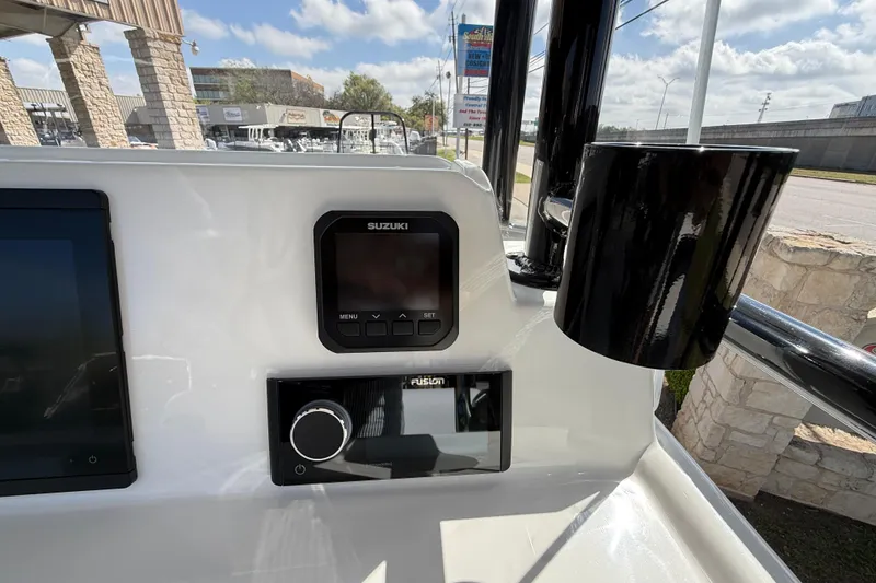 Slide: The Image of Dashboard of 2026 Shallow Sport 25 X3 boat with Suzuki and Fusion controls. - 28