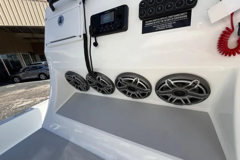 Slide: The Image of 2026 Shallow Sport 25 X3 boat console with speakers and control panel. - 34