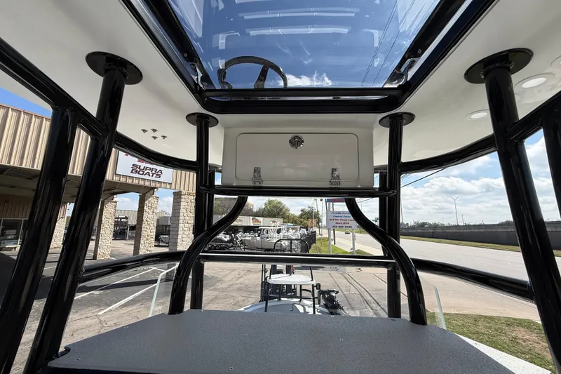 Slide: The Image of 2026 Shallow Sport 25 X3 boat interior with glass roof and black frame. - 35