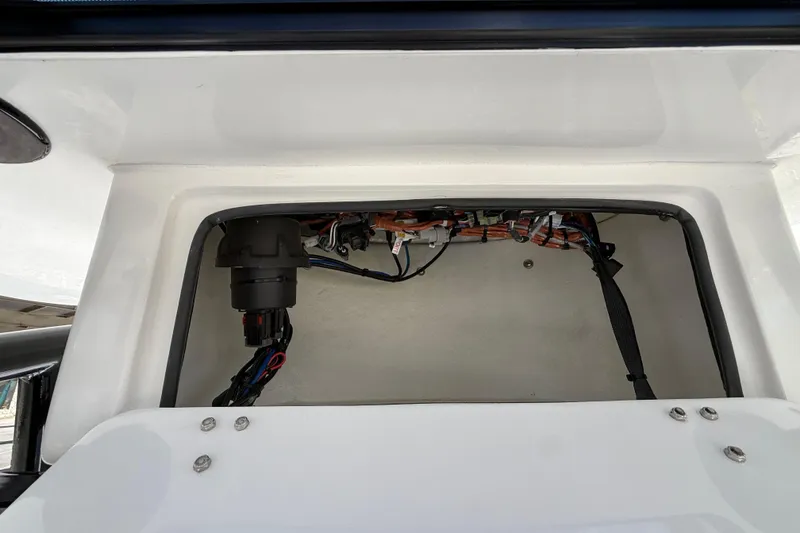 Slide: The Image of Interior view of a 2026 Shallow Sport 25 X3 boat compartment with wiring. - 36
