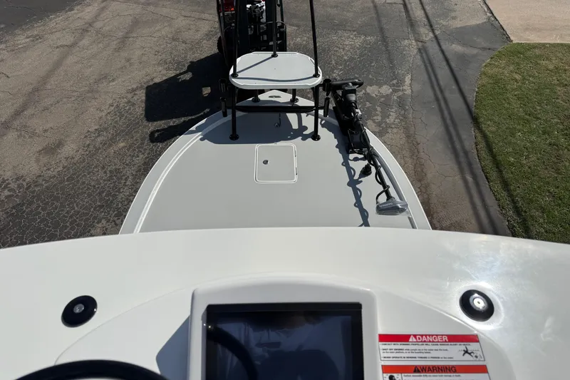 Slide: The Image of 2026 Shallow Sport 25 X3 boat, top view, featuring deck and control panel. - 43