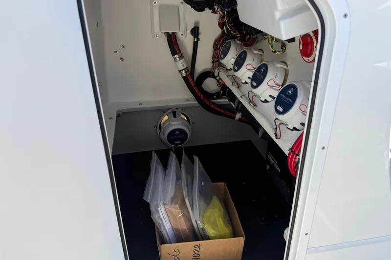 Slide: The Image of Interior view of 2026 Shallow Sport 25 X3 boat's electrical compartment. - 47