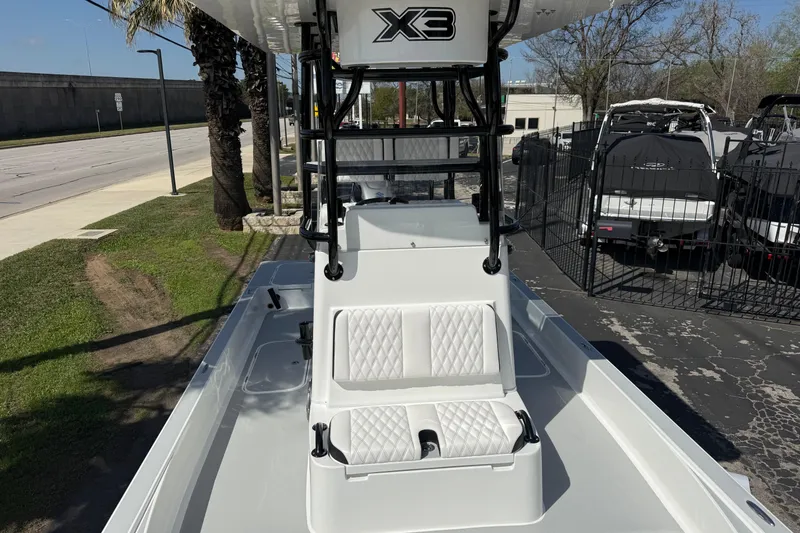 Slide: The Image of 2026 Shallow Sport 25 X3 boat with white seating and sleek design. - 48