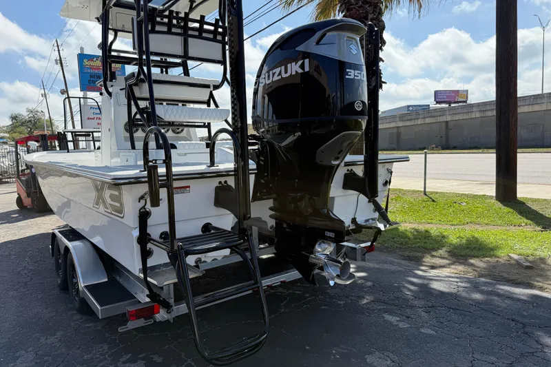 Slide: The Image of 2026 Shallow Sport 25 X3 boat with Suzuki 350 engine on trailer. - 6