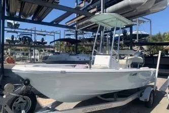 The Image of 2018 Sportsman Island Bay 18 boat on trailer in marina storage. - 0