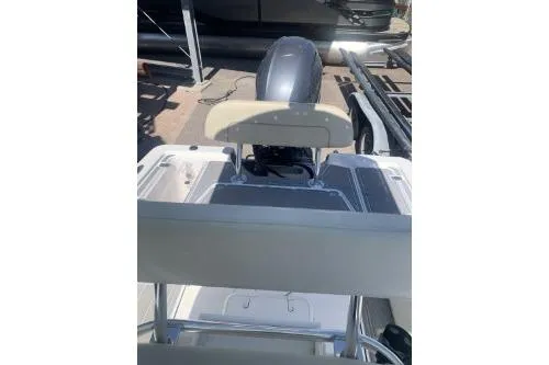 Slide: The Image of 2018 Sportsman Island Bay 18 boat with outboard motor, viewed from the rear. - 3