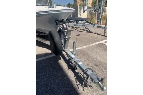 Slide: The Image of 2018 Sportsman Island Bay 18 boat trailer in a parking lot. - 5