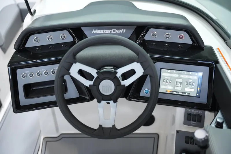 Slide: The Image of 2025 MasterCraft NXT20 dashboard with steering wheel and digital display. - 10