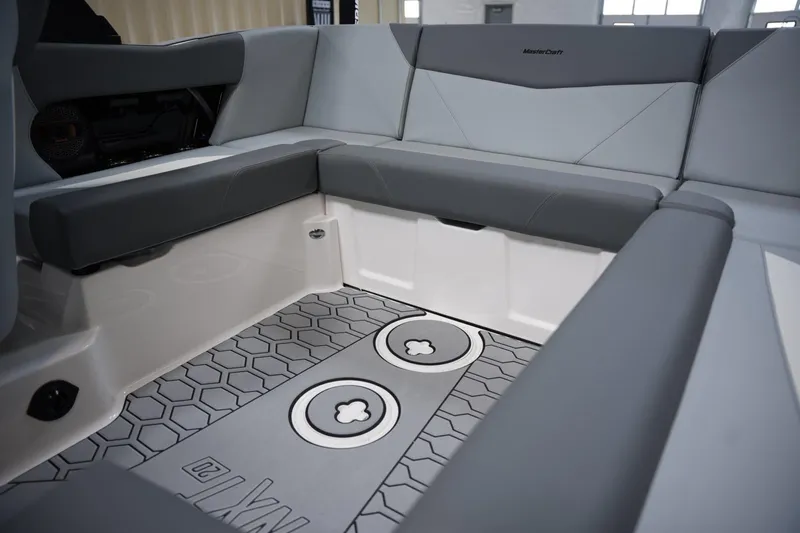 Slide: The Image of Interior seating of 2025 MasterCraft NXT20 boat with modern design and hexagonal flooring. - 12