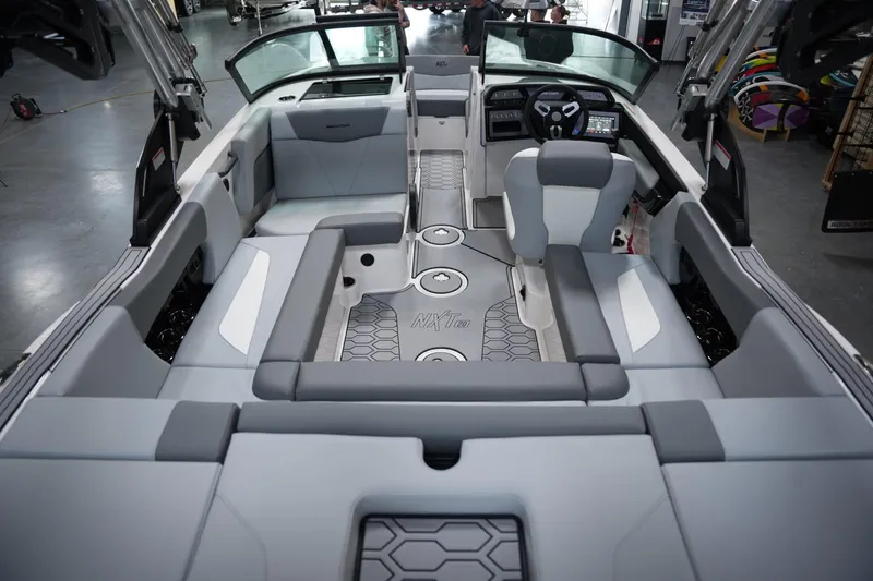 Slide: The Image of Interior of 2025 MasterCraft NXT20 boat with modern seating and dashboard. - 15