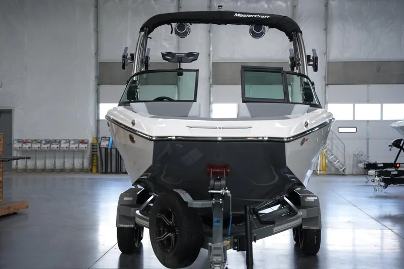 Slide: The Image of 2025 MasterCraft NXT20 boat in a showroom, front view. - 6