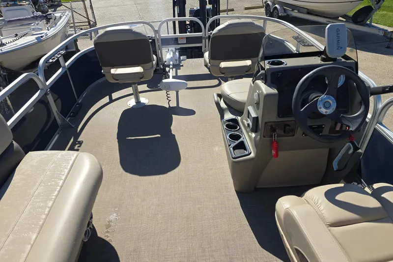 Slide: The Image of 2024 Sun Tracker Bass Buggy 16 XL Select interior with steering console and seating. - 12