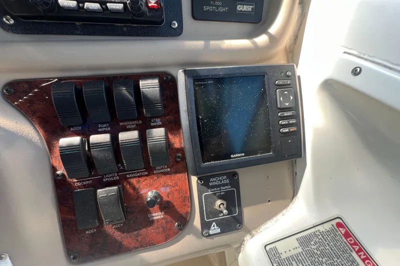 Slide: The Image of Control panel of a 1998 Sea Ray 290 Sundancer with Garmin navigation system. - 11