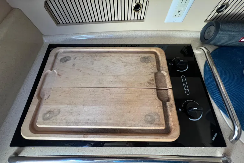 Slide: The Image of Wooden cutting board on stove in 1998 Sea Ray 290 Sundancer boat kitchen. - 18