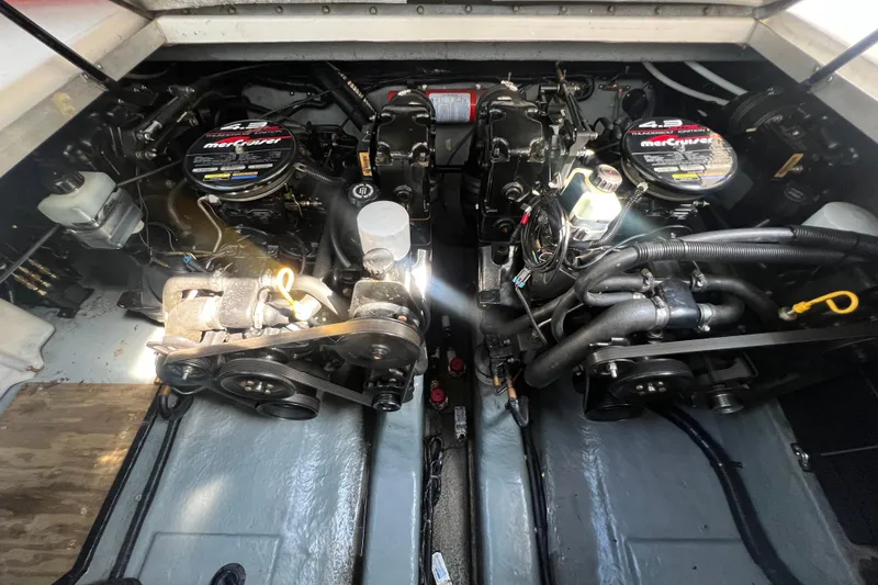 Slide: The Image of Engine compartment of a 1998 Sea Ray 290 Sundancer with twin MerCruiser engines. - 21