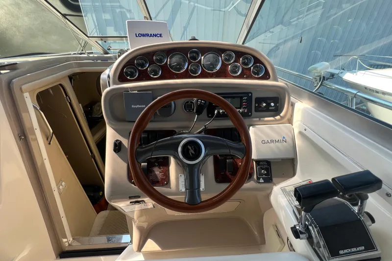 Slide: The Image of 1998 Sea Ray 290 Sundancer helm with Garmin and Lowrance navigation systems. - 9