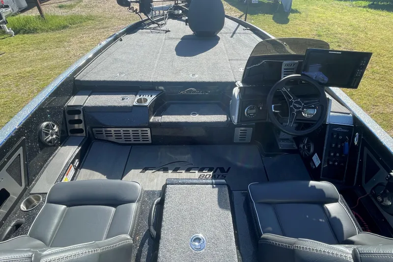 Slide: The Image of 2021 Falcon Boats F20 PREDATOR interior with steering wheel and seating, showcasing modern design. - 5