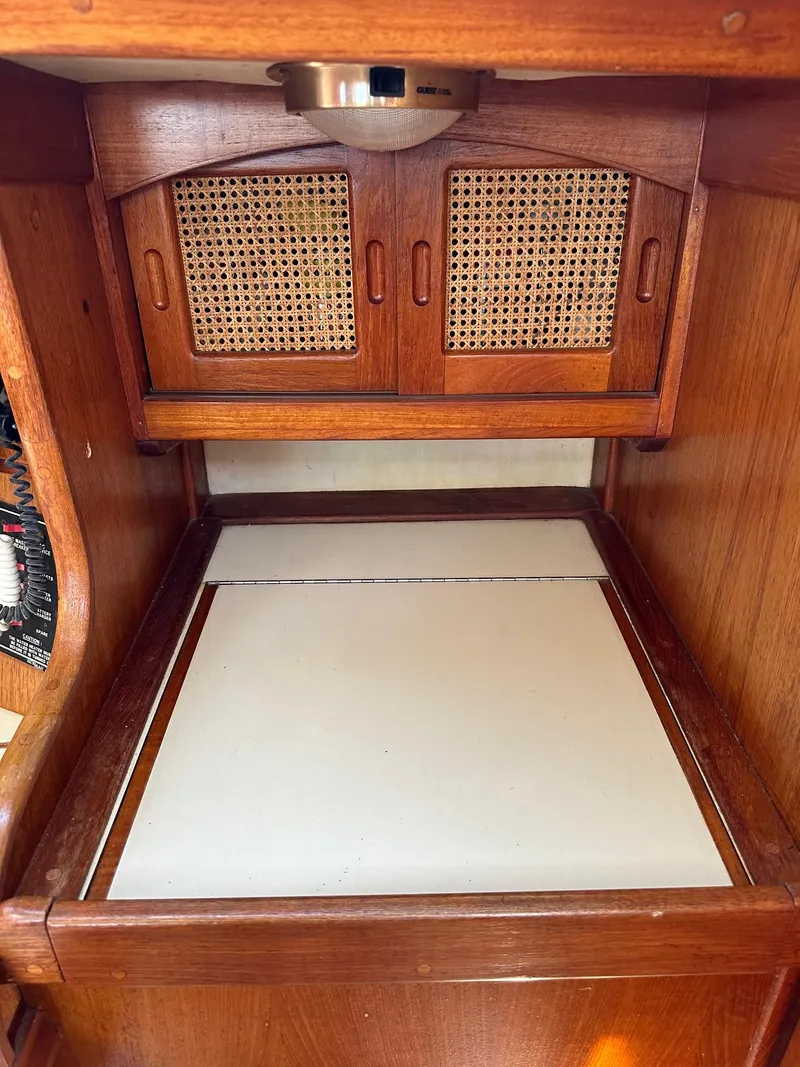 Slide: The Image of Interior cabin of a 1988 Ericson 34 sailboat with wooden cabinetry. - 15
