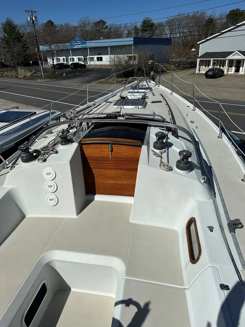 Slide: The Image of 1988 Ericson 34 sailboat deck with winches and teak companionway. - 5