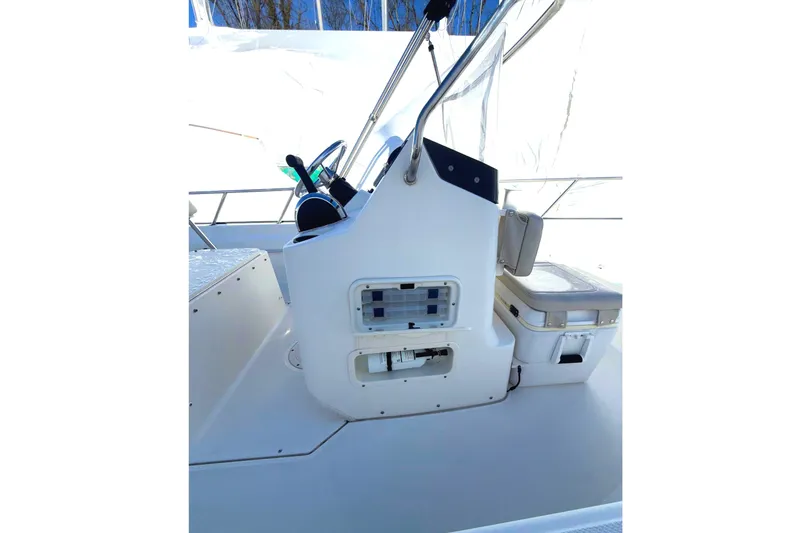 Slide: The Image of 2020 Boston Whaler 170 Montauk boat console with steering wheel and seating. - 10