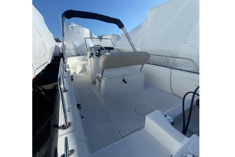 Slide: The Image of 2020 Boston Whaler 170 Montauk boat interior with steering console and seating. - 8