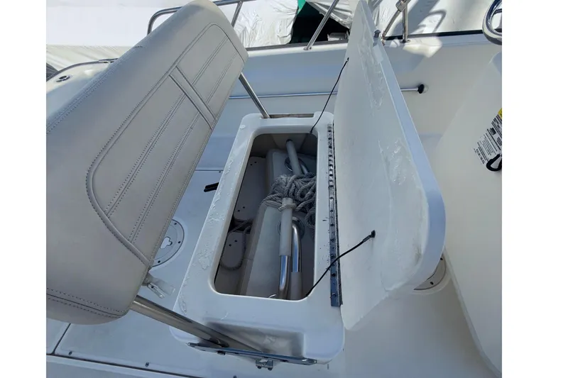 Slide: The Image of Open storage compartment on a 2020 Boston Whaler 170 Montauk boat. - 9