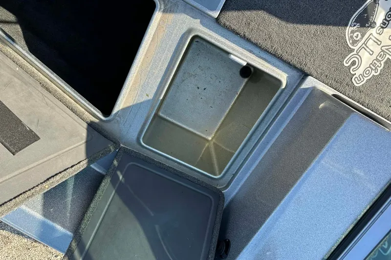 Slide: The Image of Open storage compartments on a 2018 Yar-Craft 219TFX boat deck. - 10