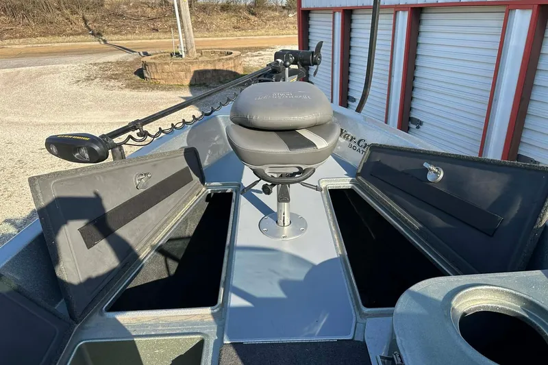 Slide: The Image of 2018 Yar-Craft 219TFX boat interior with storage compartments and seating. - 3