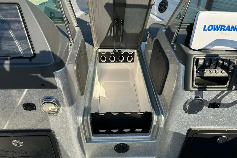 Slide: The Image of 2018 Yar-Craft 219TFX boat interior with storage compartment and Lowrance HDS system. - 30