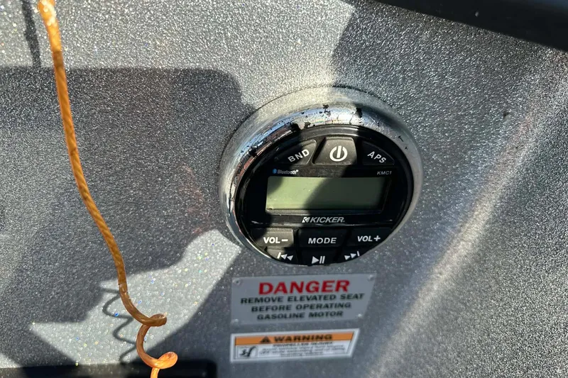 Slide: The Image of Close-up of a Kicker audio control panel on a 2018 Yar-Craft 219TFX boat. - 31