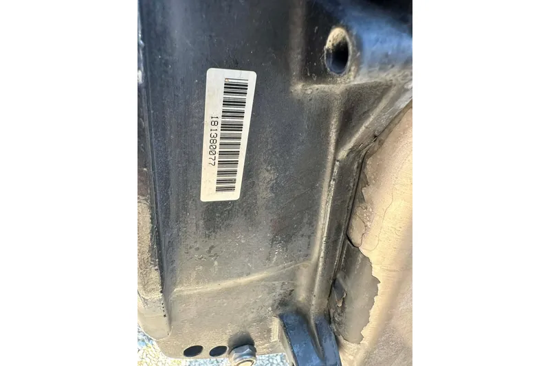 Slide: The Image of Close-up of a 2018 Yar-Craft 219TFX boat part with a barcode label. - 36