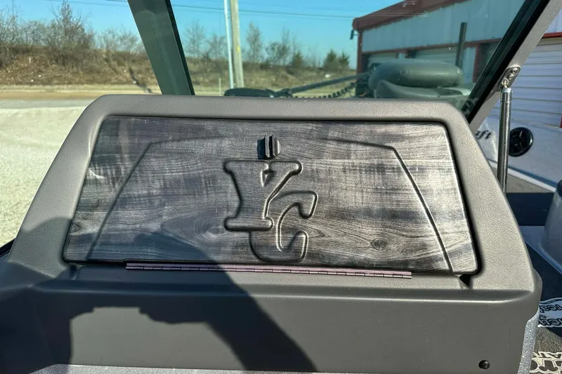 Slide: The Image of 2018 Yar-Craft 219TFX dashboard with YC logo, outdoor setting. - 45