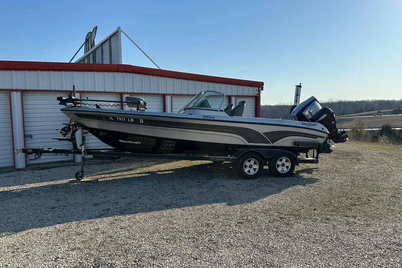 Slide: The Image of 2018 Yar-Craft 219TFX boat on trailer near storage building. - 51