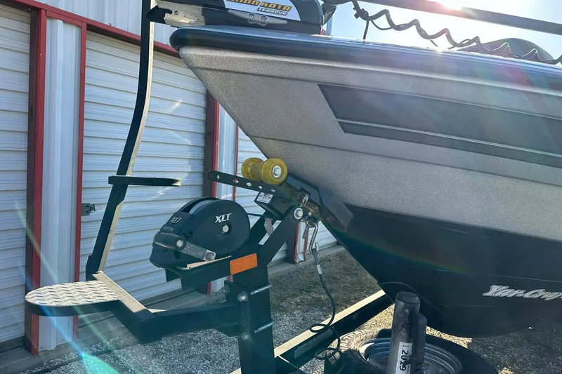 Slide: The Image of 2018 Yar-Craft 219TFX boat on trailer, parked near storage units. - 55