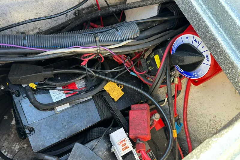Slide: The Image of Battery compartment of a 2018 Yar-Craft 219TFX boat with wiring and switch. - 9