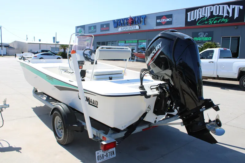 Slide: The Image of 2025 Mako Pro Skiff 17 CC boat with Mercury engine at dealership. - 16