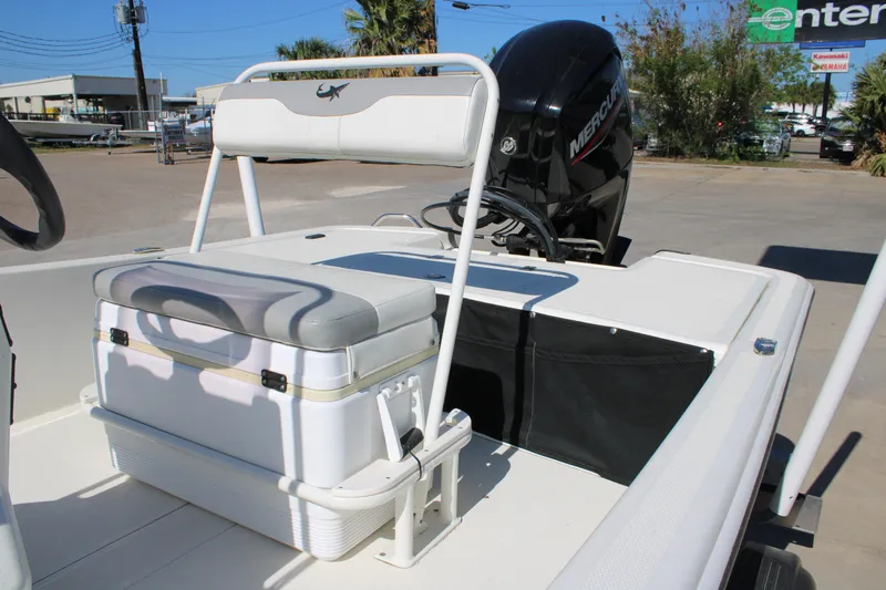 Slide: The Image of 2025 Mako Pro Skiff 17 CC boat with Mercury engine and seating area. - 4