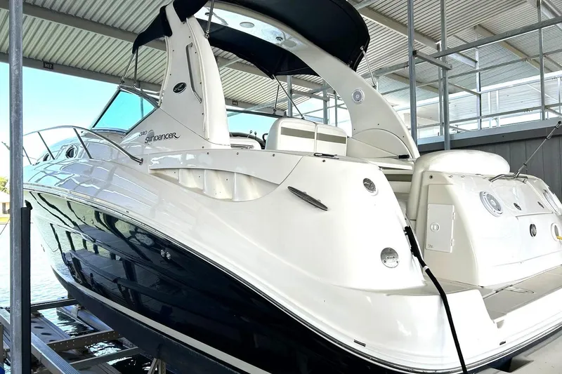 Slide: The Image of 2006 Sea Ray Sundancer 320 yacht docked in a covered marina. - 12