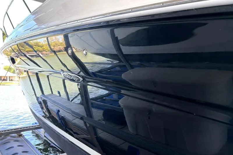 Slide: The Image of 2006 Sea Ray Sundancer 320 boat reflecting water and surroundings. - 14