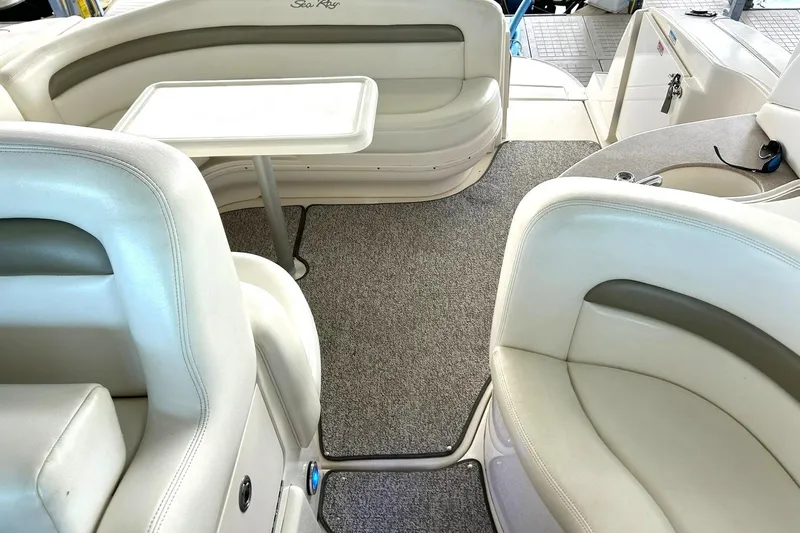 Slide: The Image of Interior of a 2006 Sea Ray Sundancer 320 boat with plush seating and table. - 26