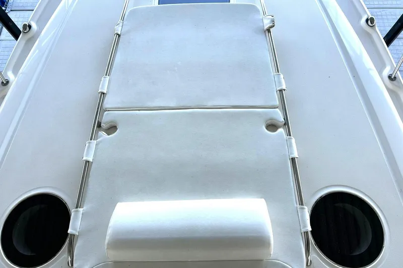 Slide: The Image of Sunpad on 2006 Sea Ray Sundancer 320 boat deck, featuring sleek design and cup holders. - 38