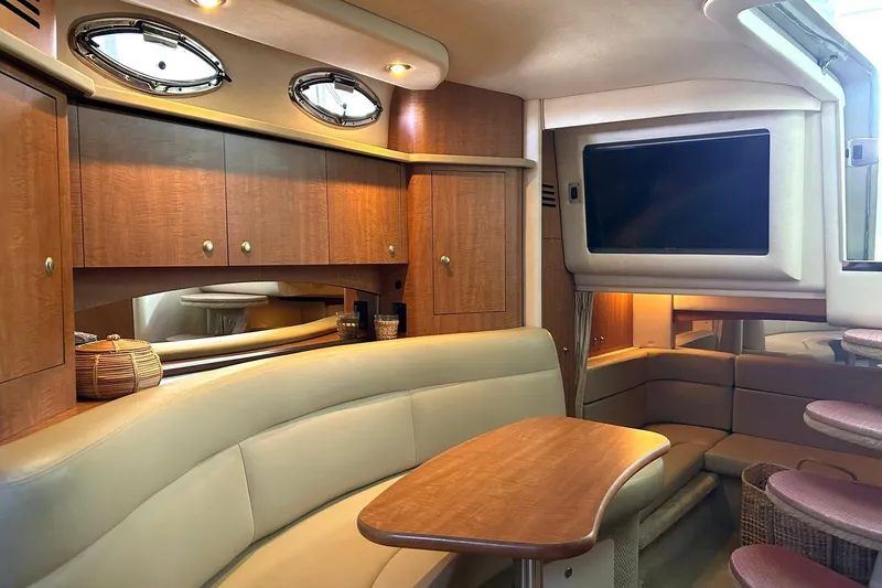 Slide: The Image of Luxurious interior of a 2006 Sea Ray Sundancer 320 yacht with elegant seating and cabinetry. - 42
